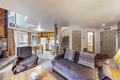 a living room with a couch and a table at Sierra Park Villas 56 L in Mammoth Lakes