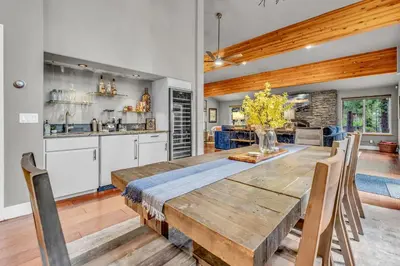 a kitchen and dining room with a wooden table and chairs at Upscale Incline Village Home with Hot Tub & Sauna in Incline Village