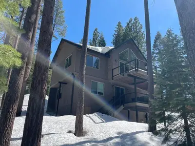 a house in the woods in the snow at Grandview Manor - Luxury - Hot tub - Stylish in South Lake Tahoe