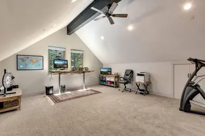 a gym with a ceiling fan and a treadmill at Grandview Manor - Luxury - Hot tub - Stylish in South Lake Tahoe