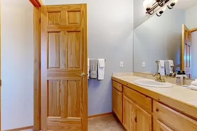 a bathroom with a sink and a mirror at Skislope Serenity in Truckee