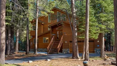 a log cabin in the woods with trees at Hansel by AvantStay Pool Table 5mins to Skiing in Truckee