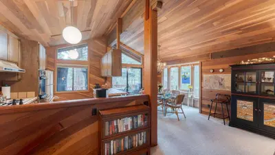 a kitchen with wooden walls and wooden ceilings at Northstar Hideaway by AvantStay 5mins to Skiing in Truckee