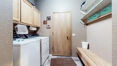a small laundry room with a washer and dryer at Snowcreek IV #545 condo in Mammoth Lakes