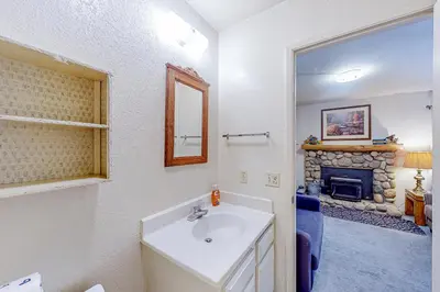 a bathroom with a sink and a fireplace at La Residence M9 in Mammoth Lakes