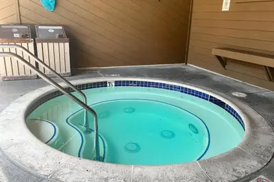a jacuzzi tub in the corner of a building at Wildflower 47 in Mammoth Lakes