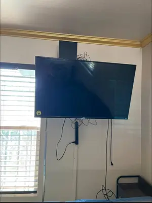 a flat screen tv hanging on a wall at Charming Casita all too yourself near Midtown, Train and Freeway in Sacramento