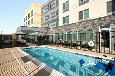 a swimming pool in front of a building at Fairfield Inn & Suites Livermore in Livermore