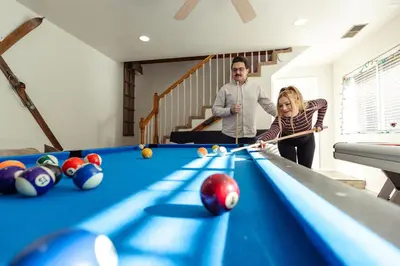 a man and a woman playing a game of pool at Eagle Retreat Mountain Escape New With AC in Shaver Lake