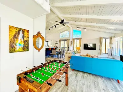 a living room with a pool table at Modern Yosemite Cabin, 15min Bass Lake, Sleeps 8 in Oakhurst