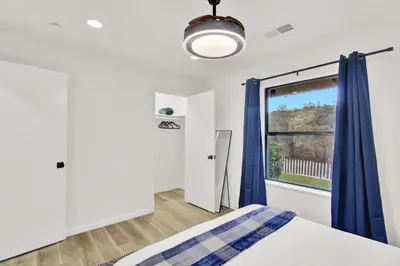 a bedroom with a bed and a window at Yosemite Forest Villa in Oakhurst