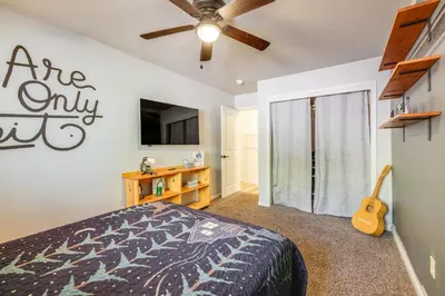 a bedroom with a bed and a ceiling fan at Forest-View Retreat Grill and Fireplace in Sonora in Sonora