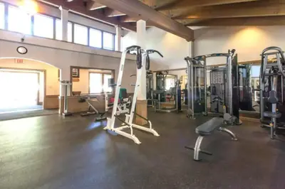 a gym with several tread machines in a room at Luxury 3 BDR Northstar Condo in Truckee
