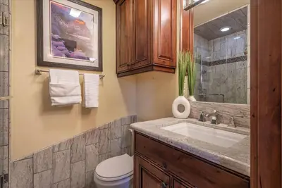 a bathroom with a sink and a toilet at Luxury 3 BDR Northstar Condo in Truckee