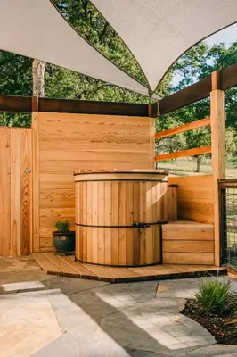 a wooden pergola with a hot tub in a patio at Romantic Yosemite Retreat - Private Zen Hot Tub in Mariposa