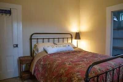 a bedroom with a bed with a pillow on it at Yosomite Gateway Historic Victorian with Modern Touch in Sonora