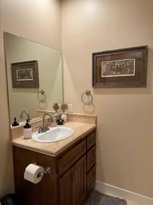 a bathroom with a sink and a mirror at Family get away Near Sly Park Lake & Apple Hill in Pollock Pines