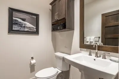 a bathroom with a white toilet and a sink at Newly Built Townhome in Snowcreek Creekhouse #1324 Three Bed Three Baths Sleeps 8! Mountain Views! in Mammoth Lakes