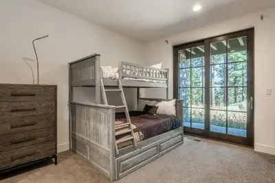 a bedroom with a bunk bed and a dresser at Newly Built Townhome in Snowcreek Creekhouse #1324 Three Bed Three Baths Sleeps 8! Mountain Views! in Mammoth Lakes