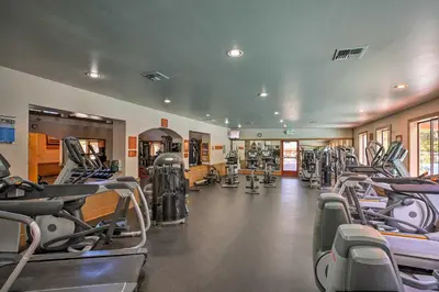 a gym with rows of treadmills and machines at Shuttle to Slopes Northstar Gem with Hot Tub Access in Truckee