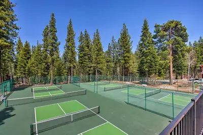 a group of tennis courts with trees in the background at Shuttle to Slopes Northstar Gem with Hot Tub Access in Truckee