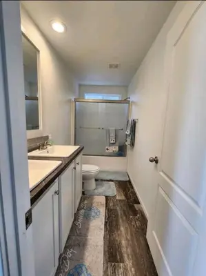a bathroom with a sink and a toilet and a mirror at Majestic View in Mariposa