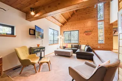 a living room with a couch and chairs at Dwell by Tahoe Getaways - 3BR Tahoe Donner w Sauna & HOA Amenities in Truckee