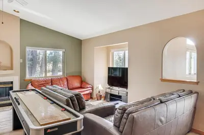 a living room with a ping pong table at 7 Mi to Beach Home with Hot Tub in South Lake Tahoe in South Lake Tahoe