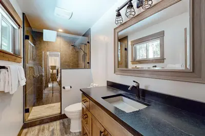 a bathroom with a sink and a toilet and a shower at Nature Lovers' Retreat in South Lake Tahoe