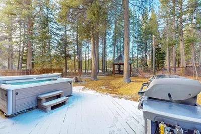 a hot tub sitting on top of a deck at Nature Lovers' Retreat in South Lake Tahoe