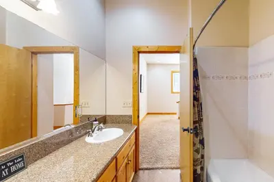 a bathroom with a sink and a shower at Baby Bear Bliss in Shaver Lake