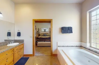 a bathroom with a tub and a sink at Baby Bear Bliss in Shaver Lake