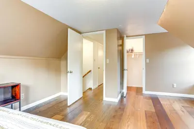an empty living room with wood floors and ceilings at 12 Mi to Folsom Historic District NorCal Getaway in Fair Oaks