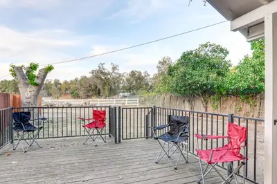 three chairs and a table on a deck at 12 Mi to Folsom Historic District NorCal Getaway in Fair Oaks