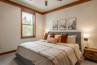 a bedroom with a large bed and a window at Obsidian 170 in Mammoth Lakes