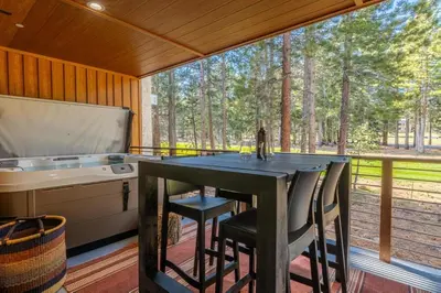 a kitchen with a table and a sink at Obsidian 170 in Mammoth Lakes