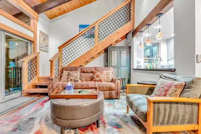 a living room with a couch and a table at Tahoe Condo Near Skylandia Beach in Tahoe City