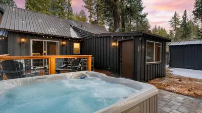 a black tiny house with a hot tub in the yard at Westlake Cabin by AvantStay Hot Tub Near Skiing Walk to Restaurants Lake in Tahoe City