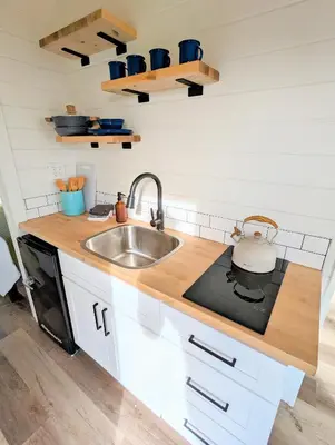 a kitchen with a sink and a counter top at Wildhaven Yosemite Glamping in Mariposa