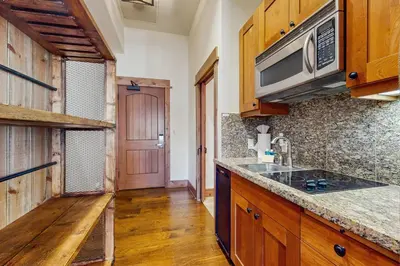 a kitchen with a sink and a microwave at Northstar Escape in Kingswood Estates