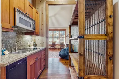 a kitchen with a sink and a door to a room at Northstar Escape in Kingswood Estates