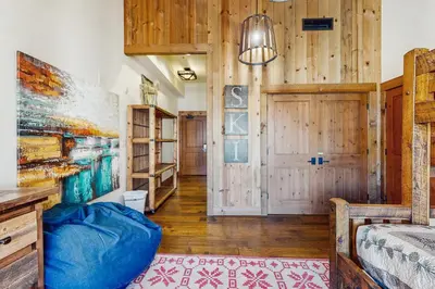 a bedroom with a bed and a wooden wall at Northstar Escape in Kingswood Estates