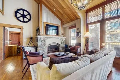 a living room with a couch and a fireplace at Northstar Getaway in Truckee