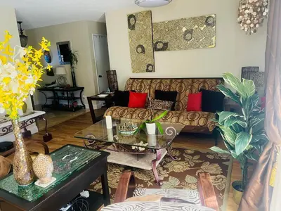 a living room with a couch and a table at Casa Pura Vida in Modesto