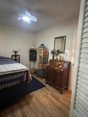 a bedroom with a bed and a dresser and a mirror at Casa Pura Vida in Modesto