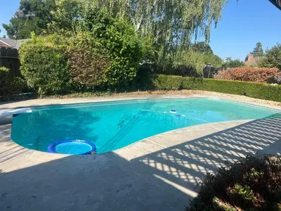 a small swimming pool in a driveway at Casa Pura Vida in Modesto