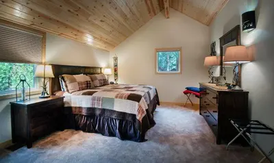 a bedroom with a bed and a desk and a window at 11N Margaret in North Wawona