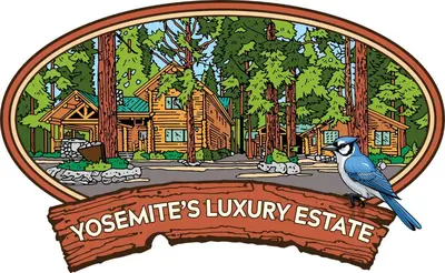 a bird sitting on a sign in front of a village at Yosemite's Luxury Estate in North Wawona