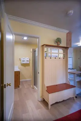 a room with a kitchen and a room with a counter at Riverfront Retreat in North Wawona