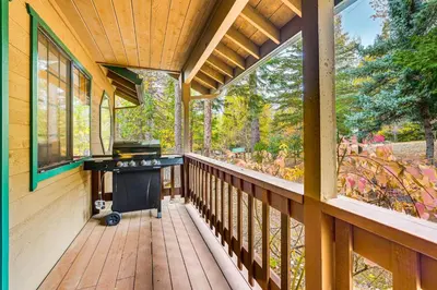 a porch of a home with a grill on it at Fire Pit, Gazebo and Grill Family Cabin in Arnold! in Arnold